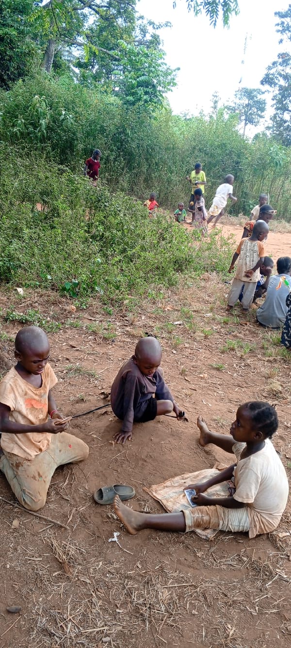 Children play traditional games in rural Congo village clearing