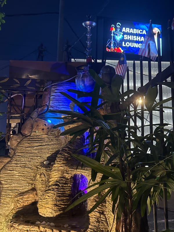 Nighttime documentation of Arabica Shisha Lounge exterior in Kuala Lumpur