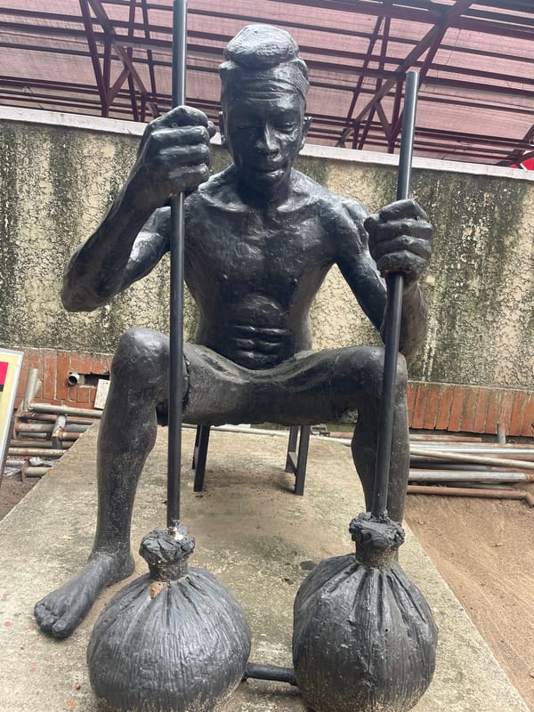 Bronze statues of seated figures documented at single location