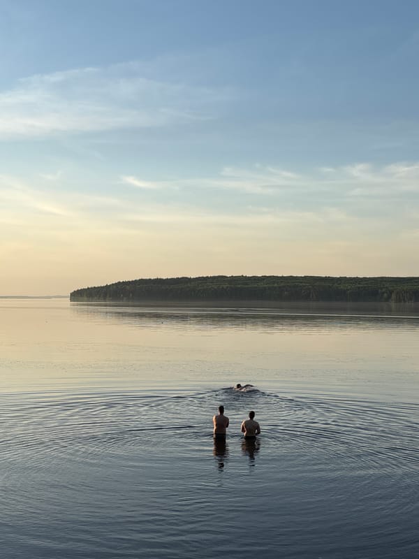 Swimmers enjoy calm waters near Chaikovsky, Russia