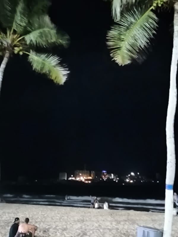 Evening beach activities and urban scenes documented in Pampatar