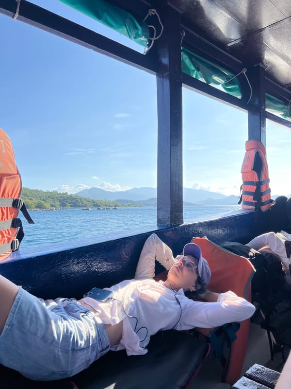 Woman rests on boat in Nha Trang waters