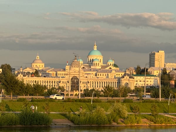 Kazan Kremlin glows at sunset, seen from the river
