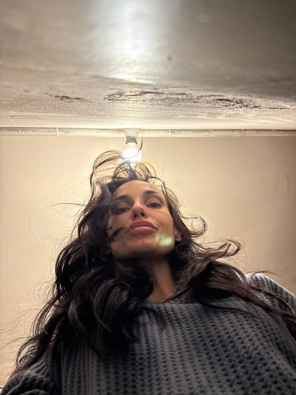 Person in gray sweater photographed in low-angle shot, Pleven