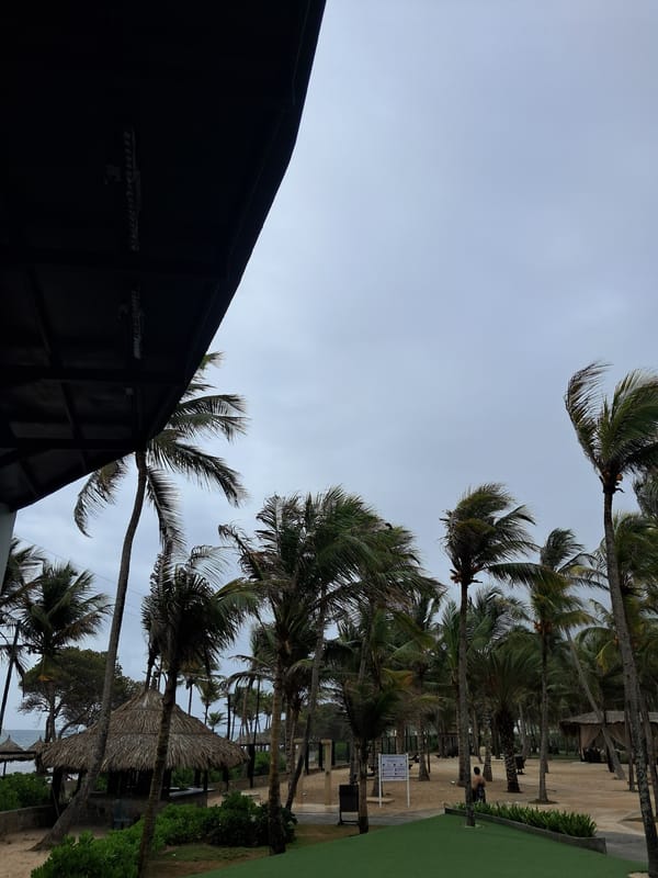 Tourist documents Venezuelan resort during overcast afternoon