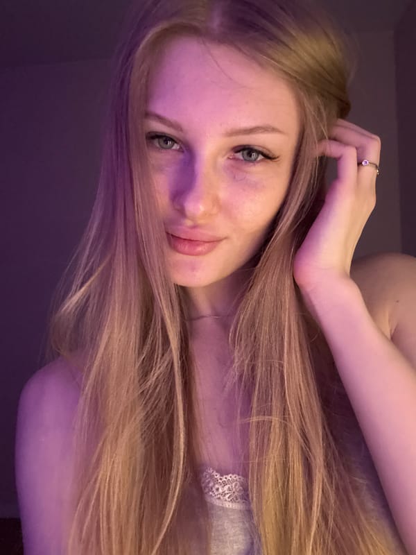 Portrait photos taken under purple lighting in Perm