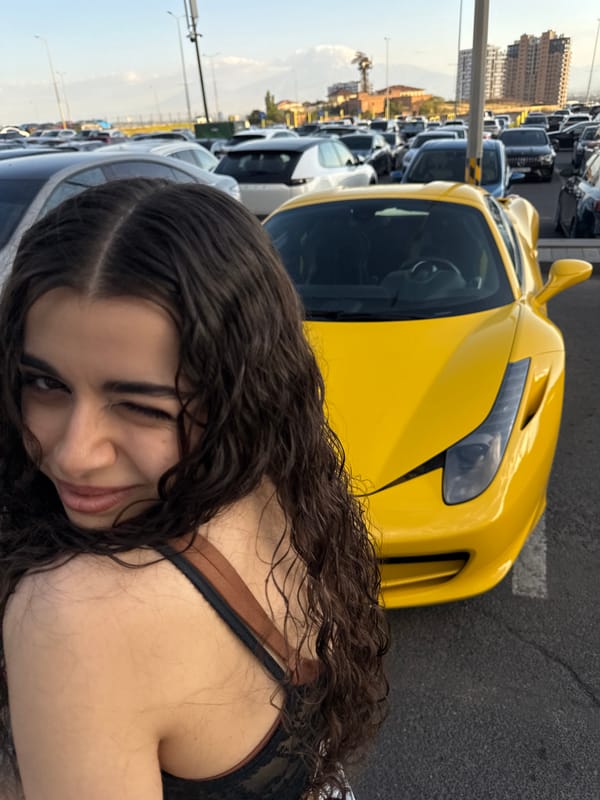 Yellow Ferrari turns heads in a Yerevan parking lot