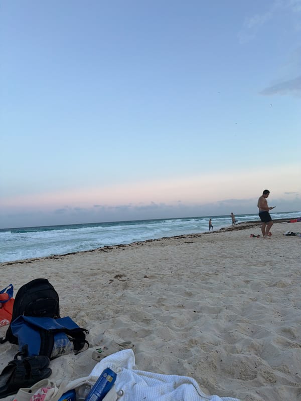 Dawn or dusk captured at Cancún beach with gradient sky
