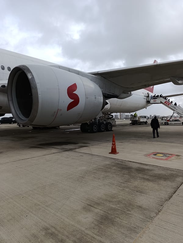 Commercial aircraft arrival and passenger disembarkation at Antalya Airport