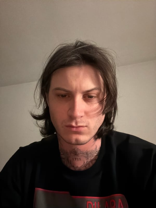 Male individual photographed indoors in London early morning