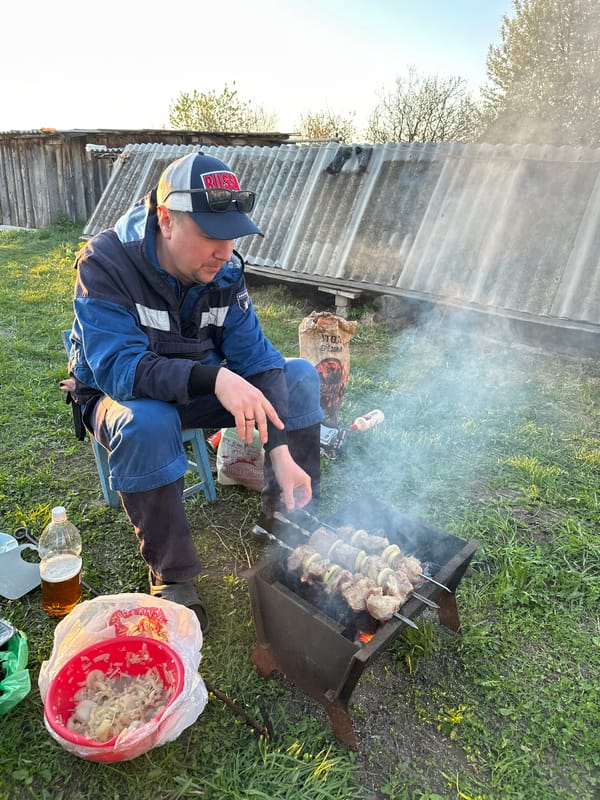 Family barbecue gathering documented in rural Russian village