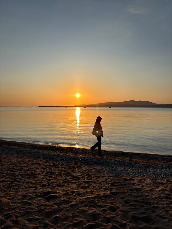 Golden hour sunset draws observers to Gelendzhik beach