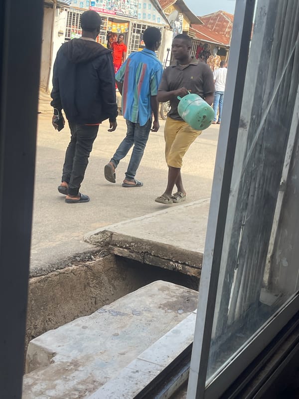 Daily street life documented across commercial Abuja districts
