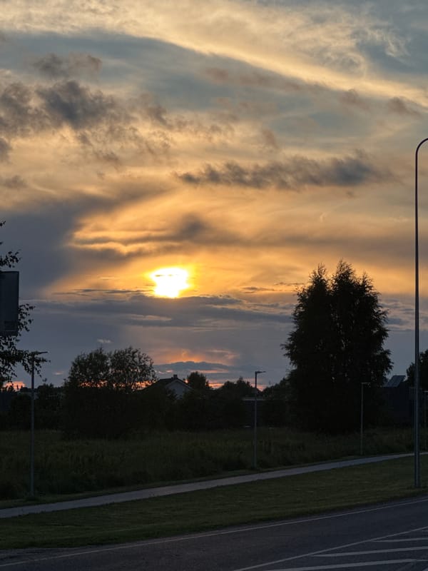 Warm sunset colors over Tallinn's suburban skyline