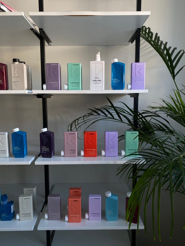 Colorful shampoo bottles documented on store shelves in Ust-Ilimsk