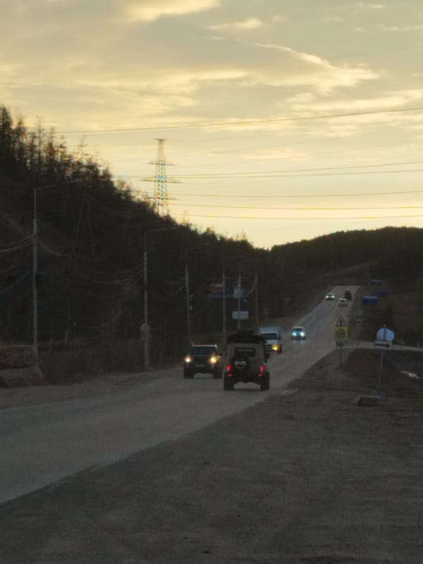 Rural Yakutsk drive documented through roads, tower, changing skies
