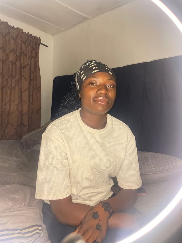 Woman conducts indoor photo session in Jos, Nigeria