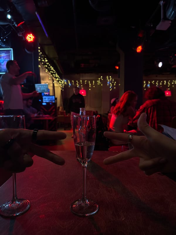 Champagne glasses photographed at crowded Moscow bar