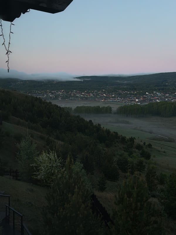 Fog blankets valley town in Shamoni, Russia