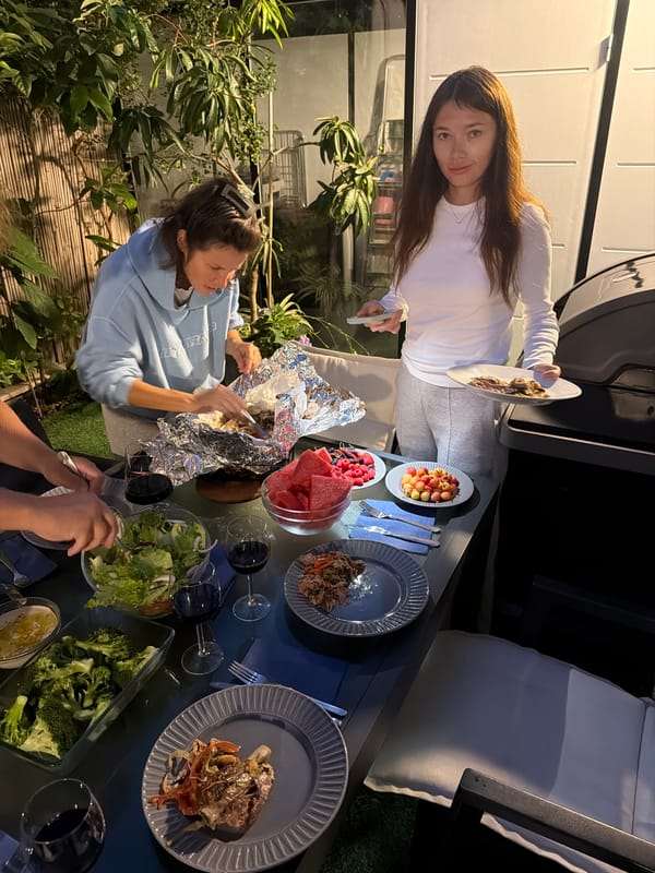 Women share outdoor meal in Herzliya residential garden