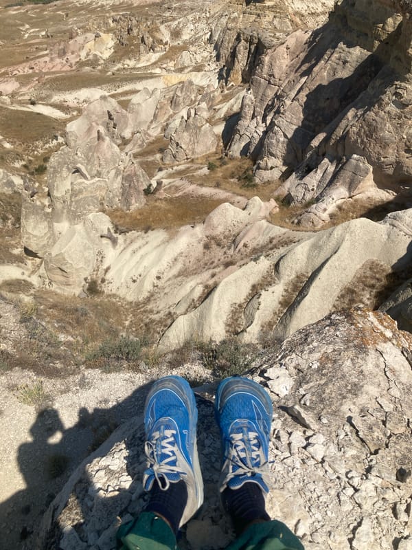 Standing on the rocks above Cappadocia's fairy chimneys