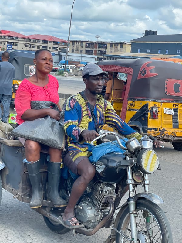 Morning street activity in Onitsha's busy market district