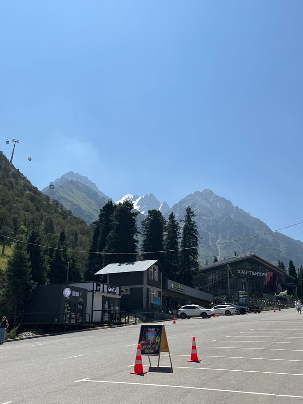 Roadside infrastructure and mountain scenery in Kashka Suu, Kyrgyzstan