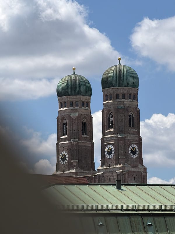 Frauenkirche twin domes rise above Munich rooftops