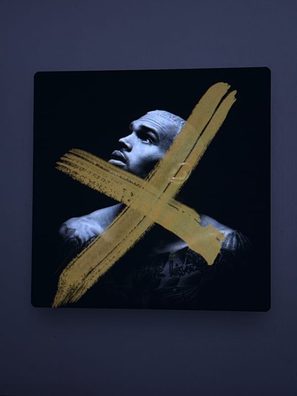 Digital screens display album art, scenic imagery, music lyrics
