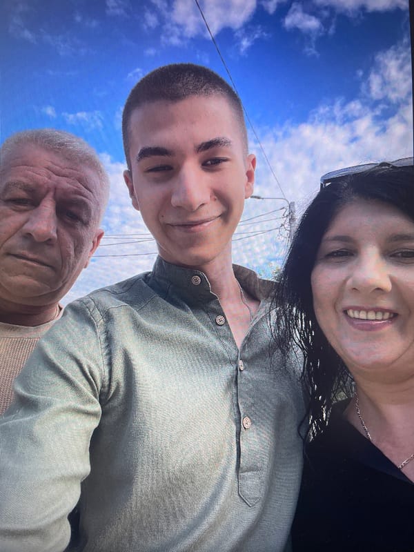 Three people pose for outdoor selfie in Iași