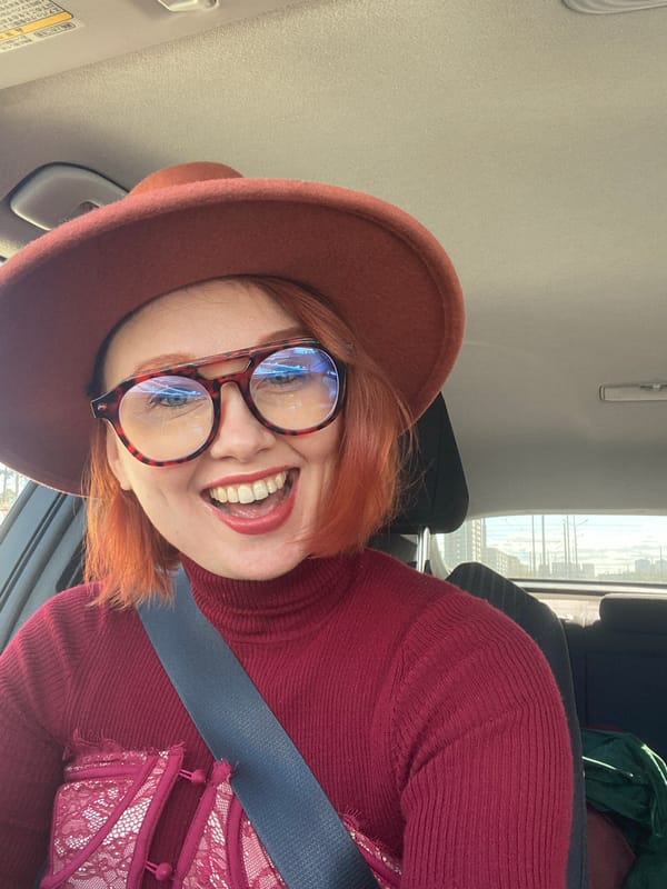 Red-haired individual takes car selfie in Yekaterinburg