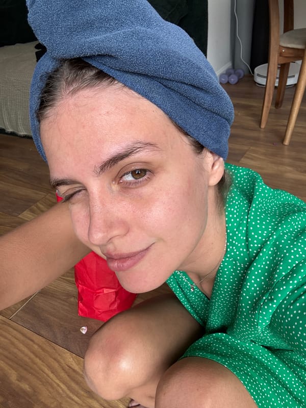 Person rests on floor in polka dot dress