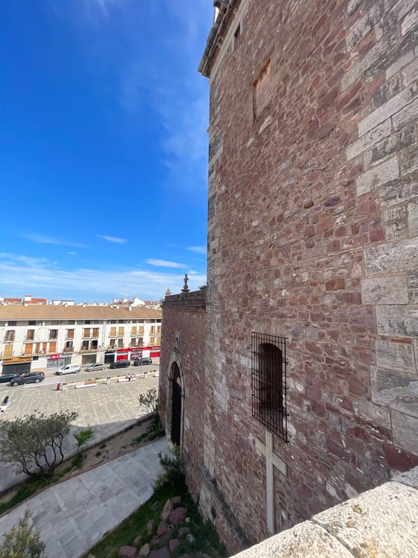 Tourist documents historic Spanish monastery architecture in detailed photo series