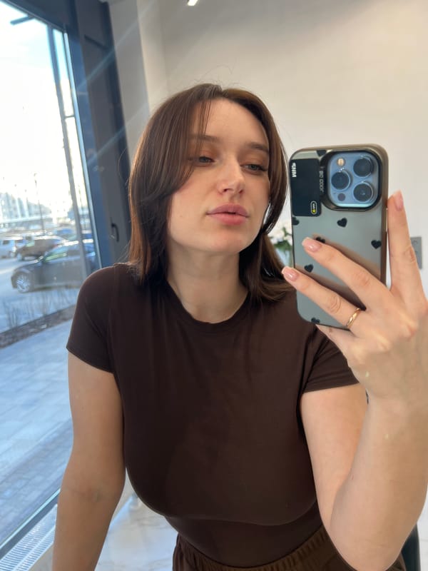 Woman takes selfies indoors in Tyumen, Russia