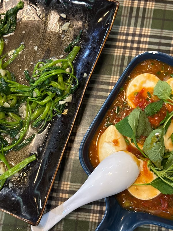 Meal photographed from above on checkered tablecloth in Hanoi