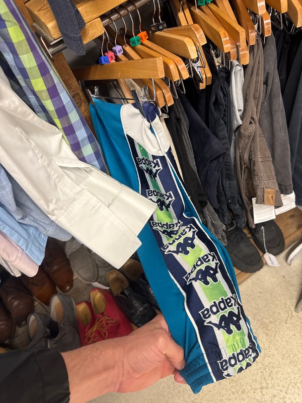 Person displays Kappa tracksuit bottoms in East Suffolk