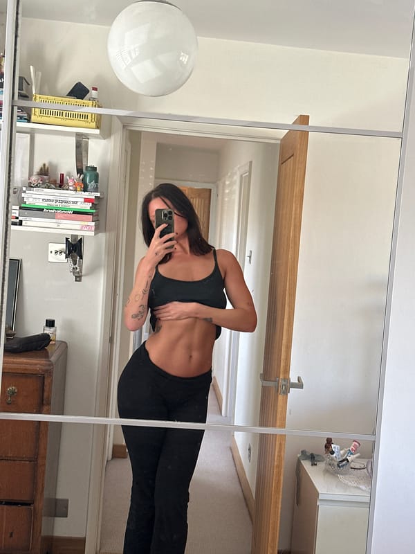 Woman Takes Mirror Selfie in Athletic Wear in Wealden