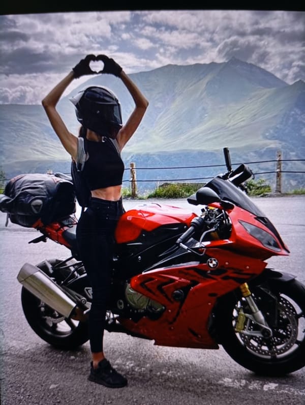 Heart hands pose in Tiraspol, full black fit and helmet