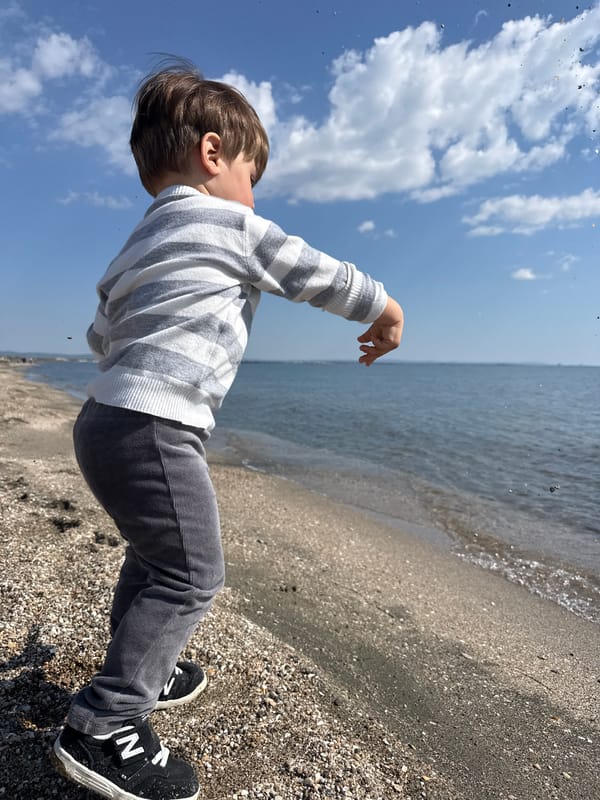 Morning moments captured in Burgas: beachside child, sunlit ladybugs