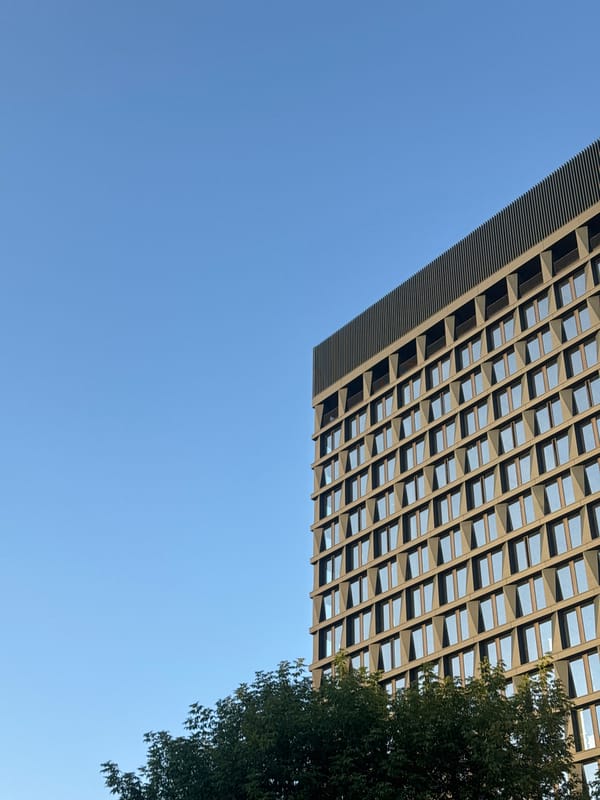 Inside and outside a modern Moscow building, late afternoon