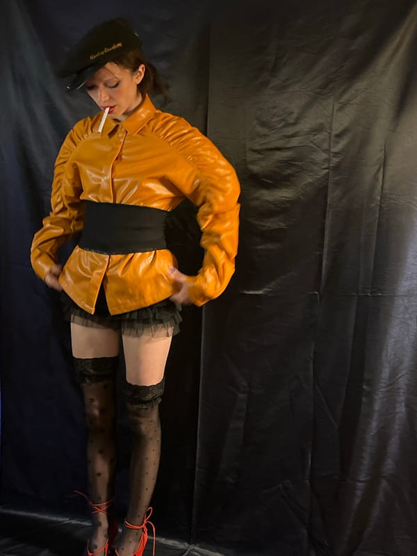 Woman in yellow jacket smoking cigarette on Barcelona street