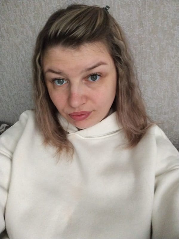 Woman in white hoodie photographed indoors in Yaroslavl
