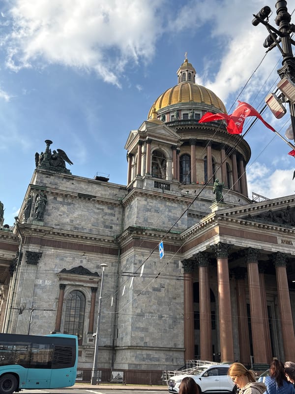 Tourist documents afternoon walk through historic Saint Petersburg landmarks
