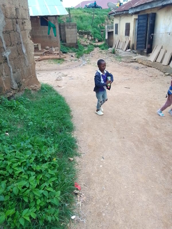 Everyday foot traffic along a weathered dirt path neighborhood