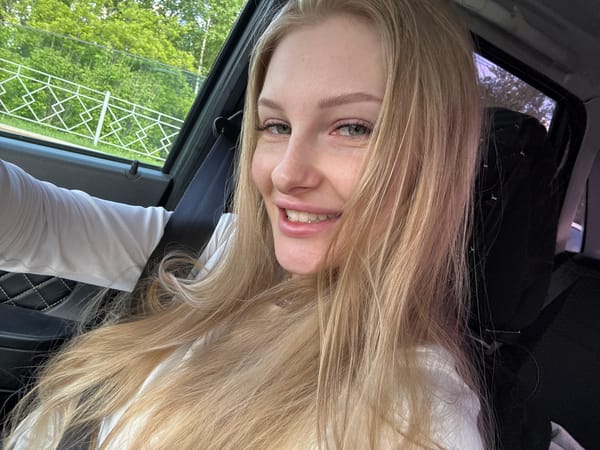 Woman takes playful selfies in car in Perm, Russia