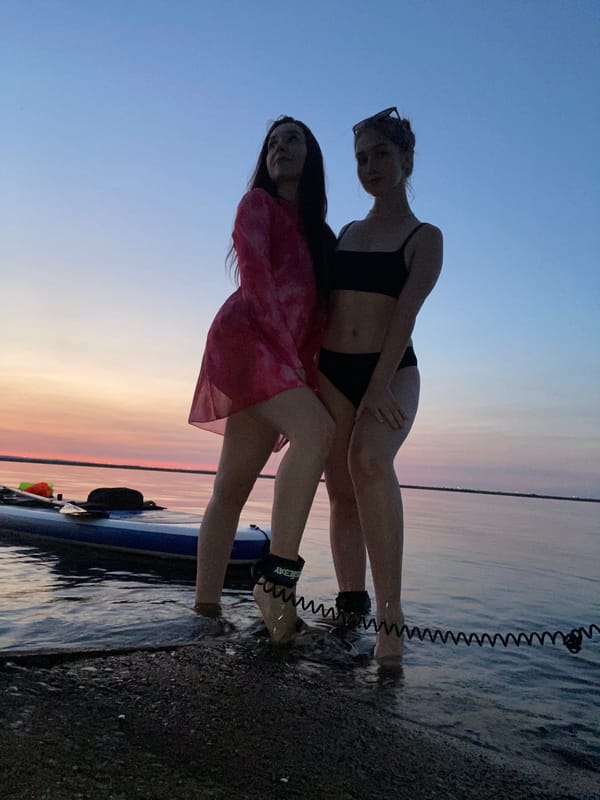 Sunset paddleboarding on calm water in Chaikovsky, Russia