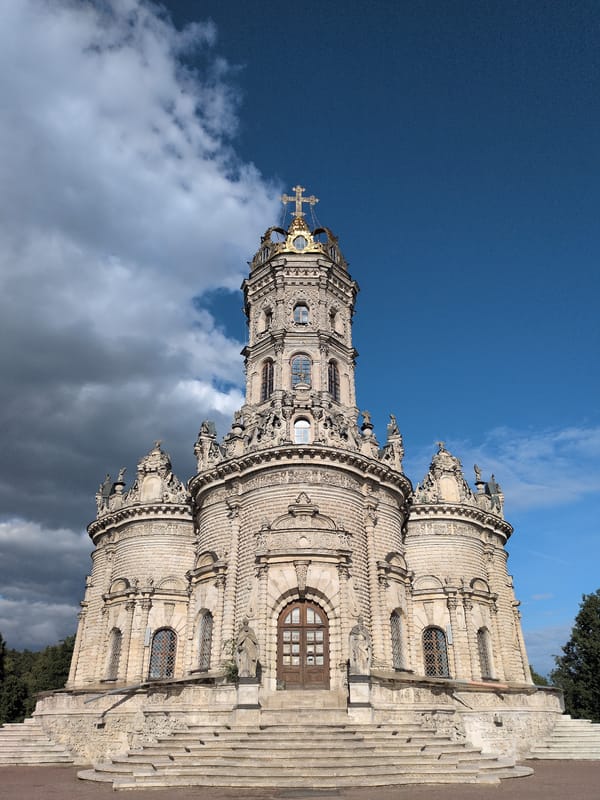 Visitor documents baroque church architecture and wildlife in Dubrovitsy