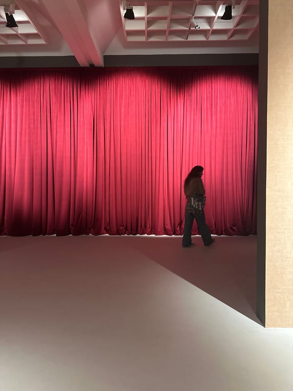Individual walks across illuminated stage in Tel-Aviv cultural venue