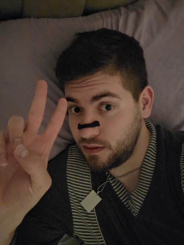 Man with nose strip poses on couch in Bulgaria