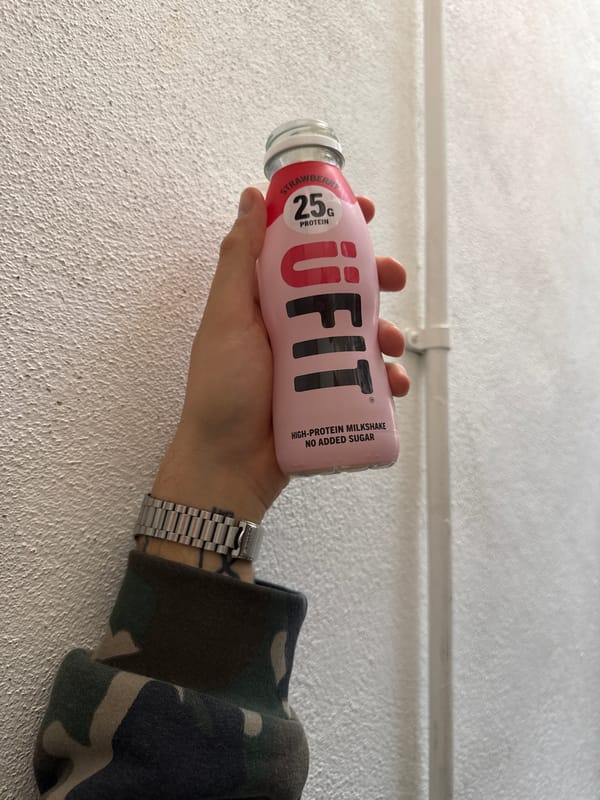 Person holds protein milkshake in London